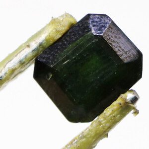 Loose Natural Corundum Sapphire Stone held with tweezers