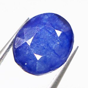 Loose Sapphire Stone held with tweezers