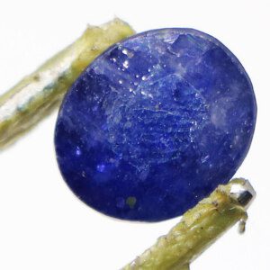 Loose Real Blue Sapphire Stone held with tweezers