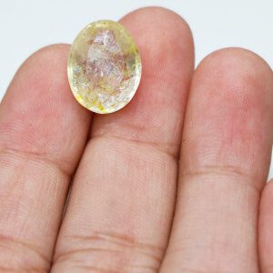 Luxurious topaz gem in hand