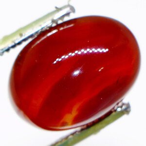 Close-up of Suleimani Agate Gemstone with Tweezers