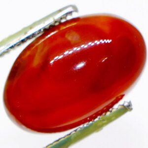 Close-up of Dream Agate Gemstone with Tweezers