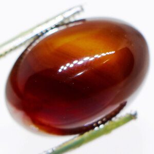 Brown agate stone with tweezers