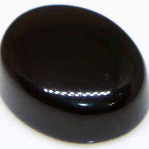 Black onyx agate loose gemstone with a smooth, polished finish.