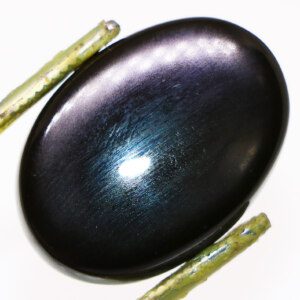 Close-up of Black Sea Agate Loose Gemstone with Tweezers